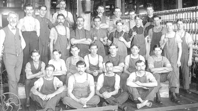 Group photo of factory employees.