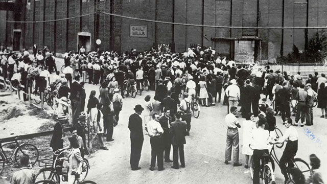 Crowd outside the factory.